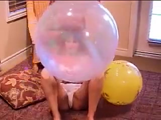 Hirl playing with many baloons