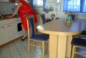 Busty German milf gets fucked on the kitchen table