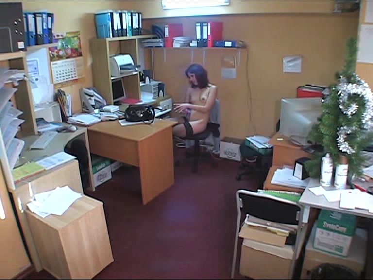 Hidden cam brunette in office
