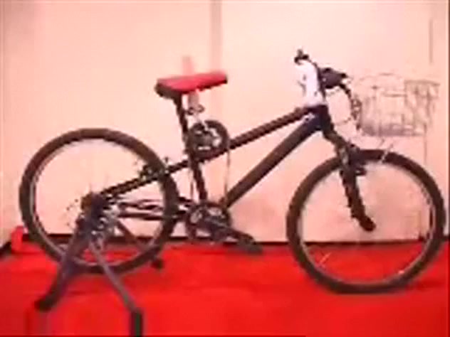 Asian girl tests out the dildo bicycle