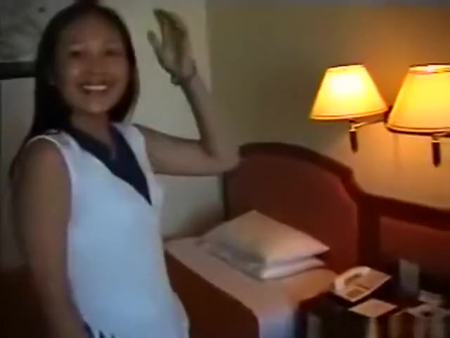 Asian girl has sex with an asian guy, while a friend tapes it.