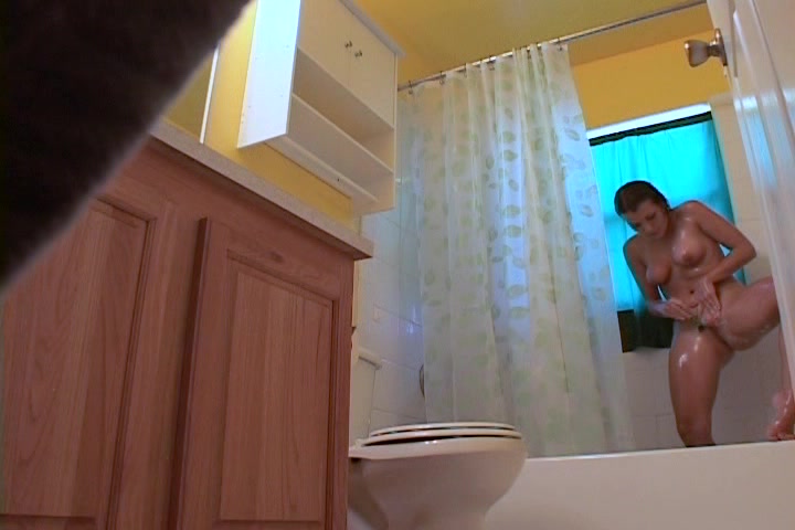 Hidden bathroom with brunette